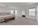 Sun-filled bedroom with plush carpet, stylish furniture, and plentiful natural light, providing a calm and spacious retreat at 2601 Gallarate Dr, Henderson, NV 89044