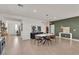 Spacious dining room showcases modern light fixture, stylish furniture, and decorative wall art at 2601 Gallarate Dr, Henderson, NV 89044
