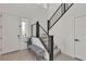Open foyer with staircase, bench seating, and natural light at 2601 Gallarate Dr, Henderson, NV 89044