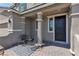 Cozy front porch with seating, a patterned rug, and stylish decor, creating a welcoming outdoor space at 2601 Gallarate Dr, Henderson, NV 89044