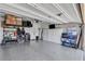 Well-organized garage with ample storage cabinets, shelving, and epoxy flooring at 2601 Gallarate Dr, Henderson, NV 89044