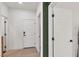 Hallway featuring multiple doors, clean lines, and neutral color scheme at 2601 Gallarate Dr, Henderson, NV 89044