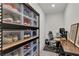 Functional home office with modern desk, shelving, and ample storage space for shoes at 2601 Gallarate Dr, Henderson, NV 89044
