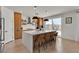 Modern kitchen features sleek island with seating, pendant lighting, and stainless steel appliances at 2601 Gallarate Dr, Henderson, NV 89044