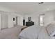 Spacious bedroom with plush carpet, king bed, and serene atmosphere and neutral paint color at 2601 Gallarate Dr, Henderson, NV 89044