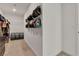Organized walk-in closet with multiple storage options including dresser, shelves, and clothes racks at 2601 Gallarate Dr, Henderson, NV 89044