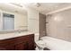 Bathroom with a new vanity, granite countertop, and combination tub and shower at 2606 Durango Dr # 181, Las Vegas, NV 89117