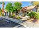 Charming exterior featuring well-maintained landscaping and convenient parking for easy access at 2606 Durango Dr # 181, Las Vegas, NV 89117