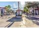 Community entrance gate with security features, set amidst desert landscaping and well-maintained surroundings at 2606 Durango Dr # 181, Las Vegas, NV 89117