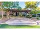 Exterior featuring a large pergola with a paved patio, surrounded by well-maintained landscaping at 2606 Durango Dr # 181, Las Vegas, NV 89117