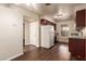 This kitchen features cherry cabinets and hardwood flooring at 2606 Durango Dr # 181, Las Vegas, NV 89117