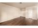 Clean, neutrally decorated room with hardwood floors, white trim, and paneled doors at 2606 Durango Dr # 181, Las Vegas, NV 89117