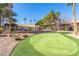 Enjoy a community putting green surrounded by well-manicured trees and landscaping at 2606 Durango Dr # 181, Las Vegas, NV 89117