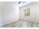 Neutral bedroom featuring bright natural light and hardwood floors throughout at 2651 Solera Moon Dr, Henderson, NV 89044