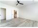 Neutral bedroom featuring bright natural light, access to the bathroom and ceiling fan at 2651 Solera Moon Dr, Henderson, NV 89044