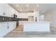 Bright kitchen featuring sleek white cabinetry, stainless steel appliances, and a functional island for meal prep at 2651 Solera Moon Dr, Henderson, NV 89044
