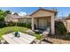 Inviting backyard with a covered patio, lounge seating, a dining area, and lush green grass at 2780 Gallant Hills Dr, Las Vegas, NV 89135