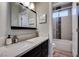 Modern bathroom with sleek vanity, quartz counters, and tiled shower and tub at 2780 Gallant Hills Dr, Las Vegas, NV 89135