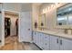 Bathroom featuring double sinks, quartz countertops and a large walk-in closet for optimal storage at 2780 Gallant Hills Dr, Las Vegas, NV 89135