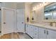 Elegant bathroom featuring double sinks, quartz countertops, and sleek modern fixtures at 2780 Gallant Hills Dr, Las Vegas, NV 89135