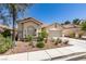 Lovely single-story home with a well-manicured front yard and drought-tolerant landscaping at 2780 Gallant Hills Dr, Las Vegas, NV 89135
