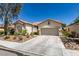 Charming single-story home with a well-manicured front yard and desert landscaping at 2780 Gallant Hills Dr, Las Vegas, NV 89135