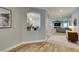 Hallway view into open-concept living space with seamless flooring and decor niche at 2780 Gallant Hills Dr, Las Vegas, NV 89135