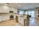 Spacious kitchen with stainless steel appliances, white cabinetry, and open access to the dining area at 2780 Gallant Hills Dr, Las Vegas, NV 89135
