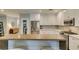 Bright kitchen with white cabinets, stainless steel appliances, granite countertops, and a breakfast bar at 2780 Gallant Hills Dr, Las Vegas, NV 89135