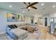Open-concept living area with sleek fireplace, wooden accents, modern artwork, and comfortable seating creating an inviting atmosphere at 2780 Gallant Hills Dr, Las Vegas, NV 89135