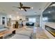 Bright, open-concept living space connecting kitchen, dining and lounge areas, accentuated by modern elements and abundant natural light at 2780 Gallant Hills Dr, Las Vegas, NV 89135