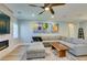Bright living room featuring neutral tones, contemporary artwork, and a wooden coffee table, perfect for modern living and entertaining at 2780 Gallant Hills Dr, Las Vegas, NV 89135