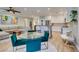Open-concept living room, kitchen, and dining area showcasing a comfortable sectional sofa and glass dining table at 2780 Gallant Hills Dr, Las Vegas, NV 89135