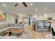 Open living space with sleek modern kitchen, bar seating, dining area, and comfortable seating arrangements, ideal for socializing at 2780 Gallant Hills Dr, Las Vegas, NV 89135