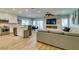 Open concept living room and kitchen with stainless steel appliances and fireplace at 2780 Gallant Hills Dr, Las Vegas, NV 89135
