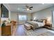 Spacious bedroom with hardwood floors, a ceiling fan, and modern decor throughout at 2780 Gallant Hills Dr, Las Vegas, NV 89135