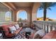 Inviting covered balcony with comfortable seating and views of neighborhood at 30 Via Mantova # 109, Henderson, NV 89011