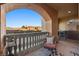 An arched balcony overlooking a community of homes with desert landscaping at 30 Via Mantova # 109, Henderson, NV 89011