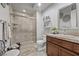 This bathroom features a glass enclosed shower, vanity, and a toilet at 30 Via Mantova # 109, Henderson, NV 89011