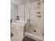 Bathroom featuring walk in shower and soaking tub under a window at 30 Via Mantova # 109, Henderson, NV 89011