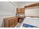 This bedroom features built in desk, cabinets and a murphy bed at 30 Via Mantova # 109, Henderson, NV 89011