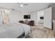 Bright bedroom offers neutral decor, hardwood floors, and access to both a living area and the bathroom at 30 Via Mantova # 109, Henderson, NV 89011