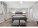 Bright bedroom with plush rug and neutral decor, including en suite bathroom access at 30 Via Mantova # 109, Henderson, NV 89011