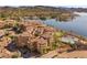 Lovely multi-unit homes showcasing red tile roofs, waterfront views, swimming pool, and well-kept grounds at 30 Via Mantova # 109, Henderson, NV 89011