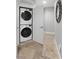 A laundry closet equipped with a stacked washer and dryer at 30 Via Mantova # 109, Henderson, NV 89011
