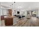 This large space combines a modern kitchen with an island and a living room with access to the patio and fireplace at 30 Via Mantova # 109, Henderson, NV 89011