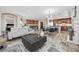 Open concept living space featuring wood flooring, modern fixtures and furnishings at 30 Via Mantova # 109, Henderson, NV 89011