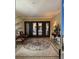 Elegant lobby with custom mosaic tile flooring, stylish seating, and ornate wrought iron doors at 30 Via Mantova # 109, Henderson, NV 89011