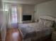 Comfortable bedroom features hardwood floors, natural light, and a cozy atmosphere at 3164 Elmrock Pl, Las Vegas, NV 89121