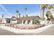 Charming single-story home with a xeriscaped front yard and mature palm trees at 3164 Elmrock Pl, Las Vegas, NV 89121